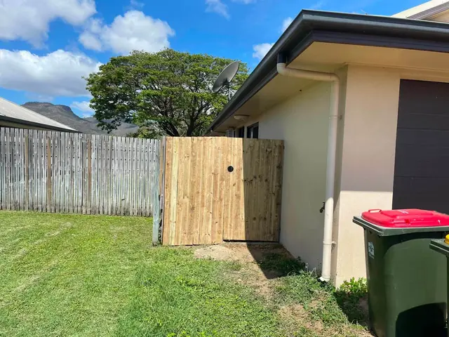 A new timber gate beside a house