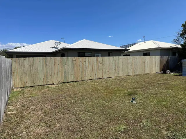 Kirwan or Mount Low: New boundary fence in a backyard, old fence on the right