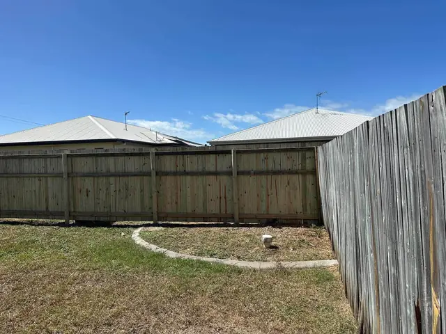 Kirwan or Mount Low: Timber fence and a paved courtyard