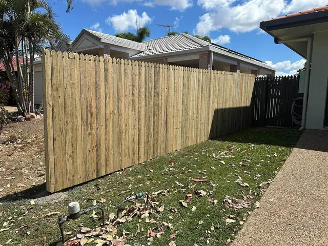 A new timber paling boundary fence in a Kirwan backyard